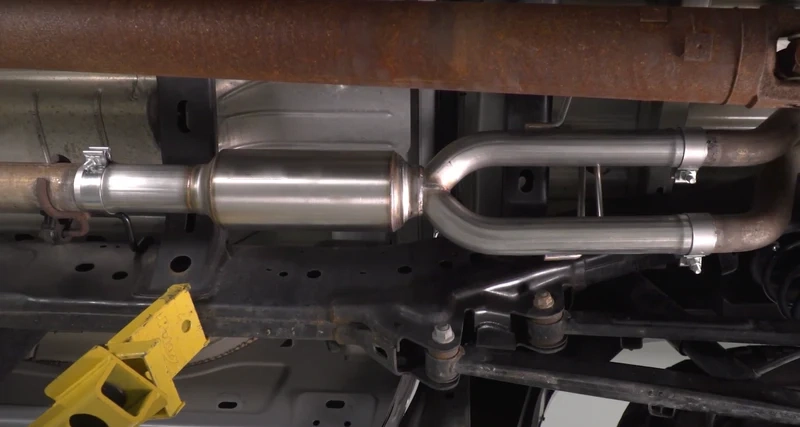 exhaust system installed under car on lift